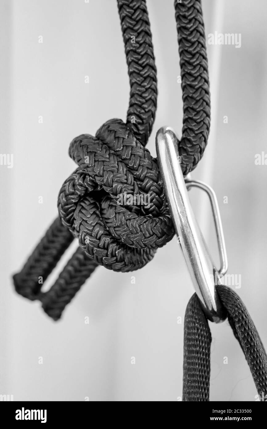 a carabiner is hooked into a loop Stock Photo