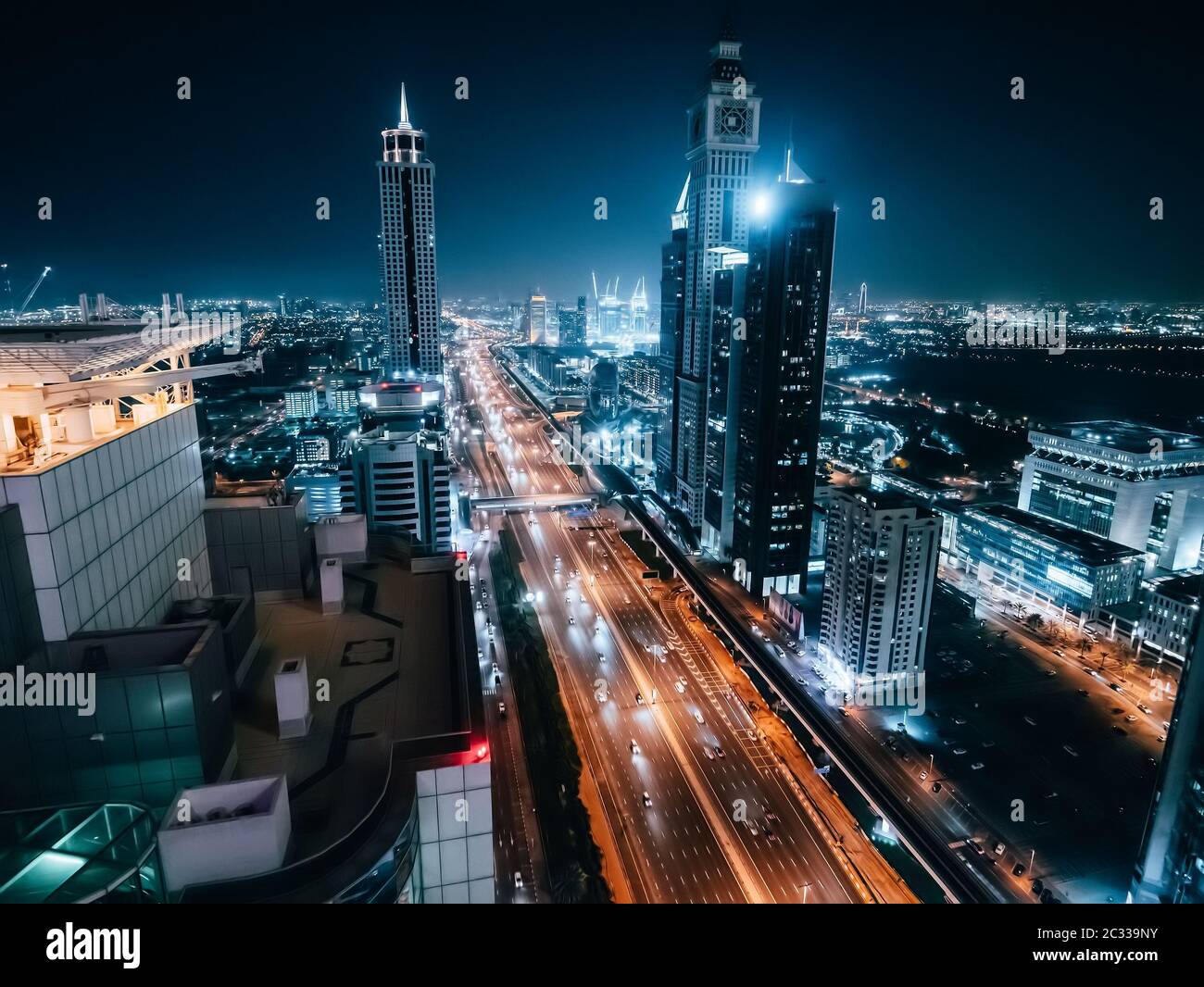 Dubai skyline at night, urban skyscrapers and car traffic, view from above, United Arab Emirates. Stock Photo