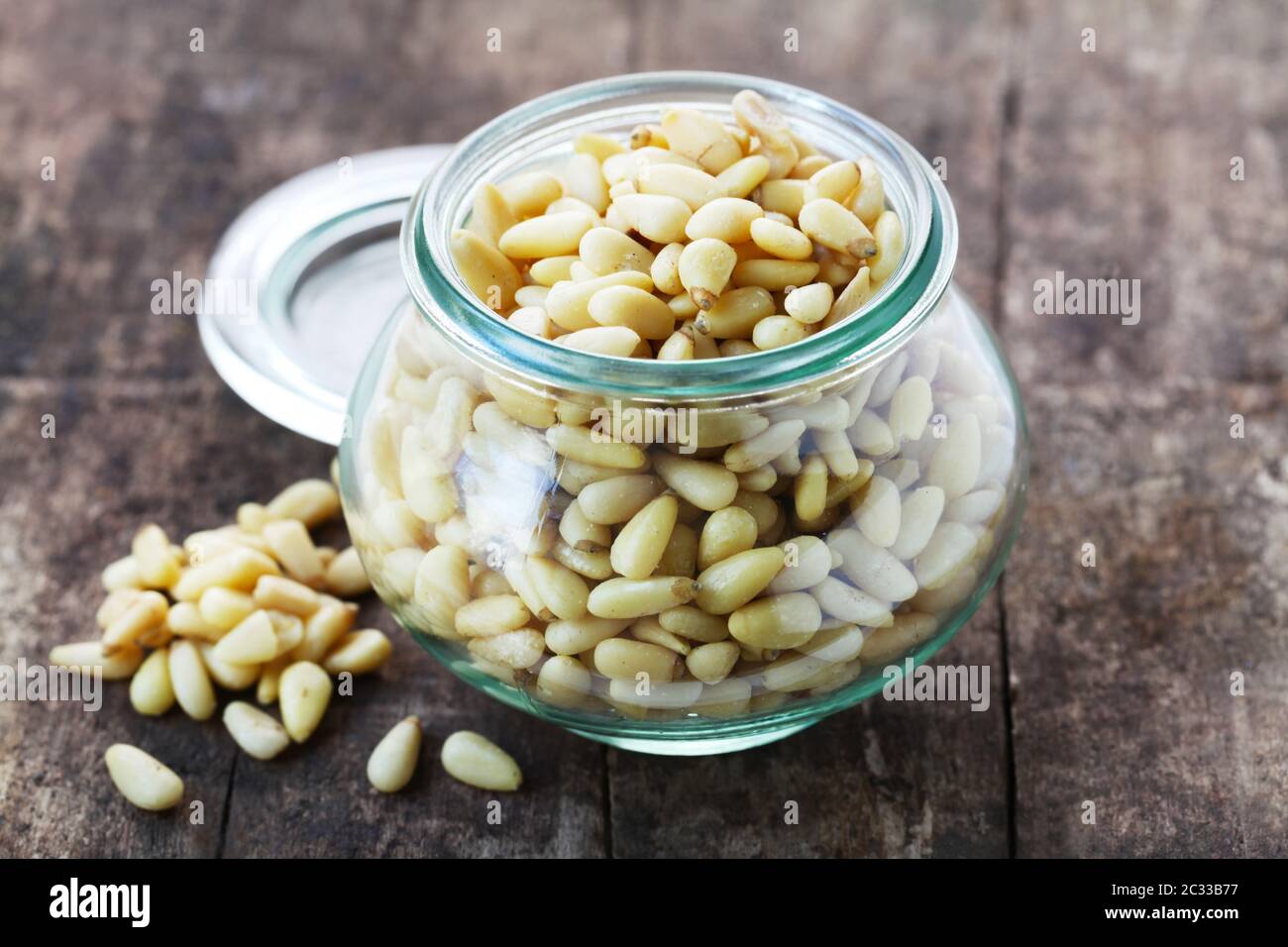 Pine Nuts In A Jar On A Wooden Background Stock Photo