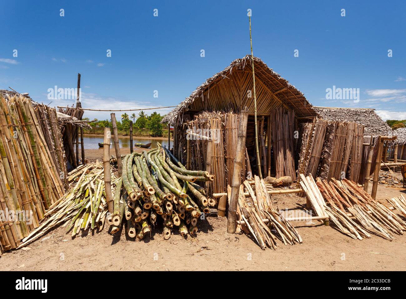 sale of firewood on street marketplace in Maroantsetra city, Madagascar. Deforestation is big problem. Stock Photo