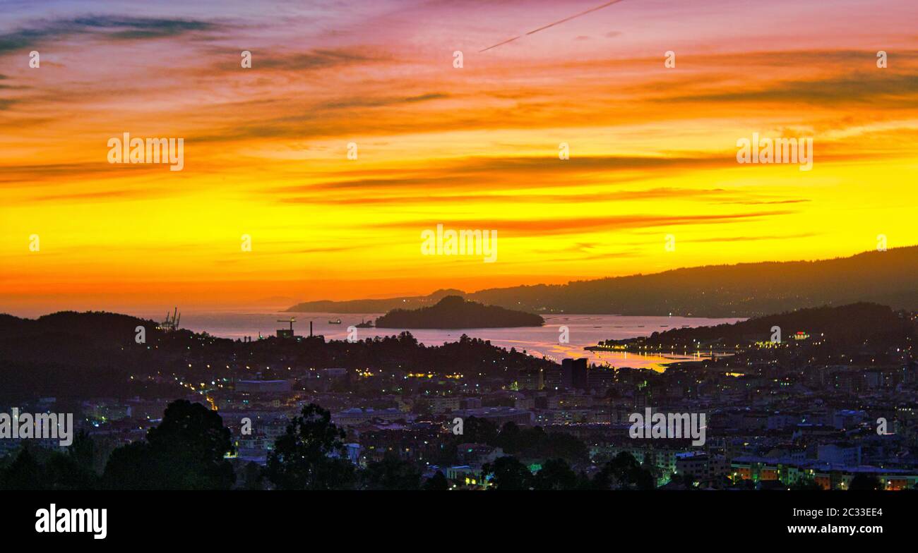 Sunset over the city of Pontevedra, Poio, Ria de Pontevedra and Tambo Island. Stock Photo