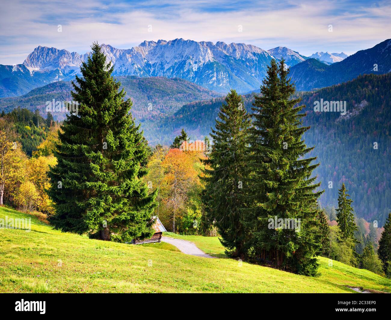 View from the top of mountain Eckbauer in Bavaria to alps in the region of Garmisch-Partenkirchen, Germany in autumn on a sunny day in autumn Stock Photo