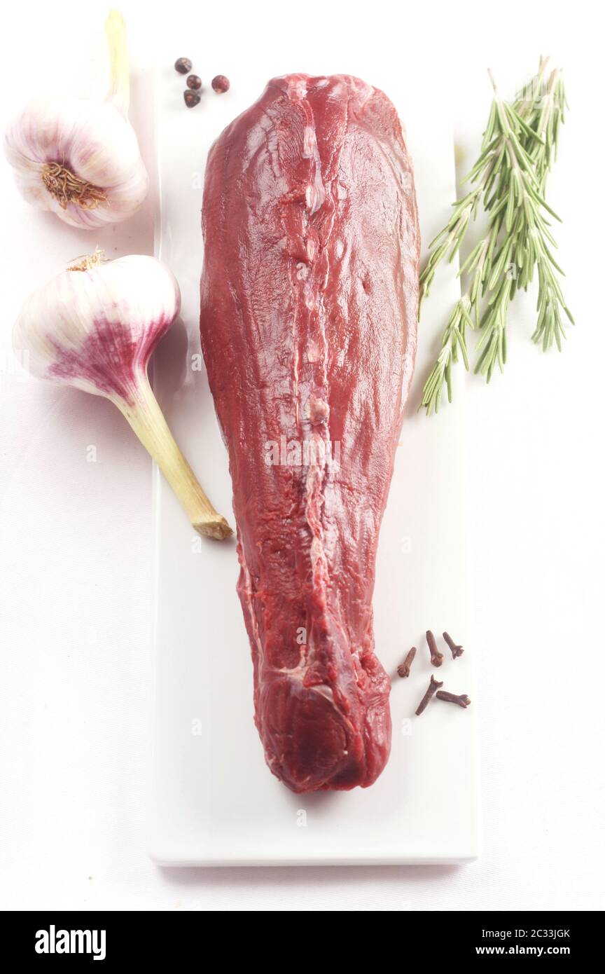 Raw Saddle of Hare with Herbs and Spices on a White Background Stock Photo  - Alamy