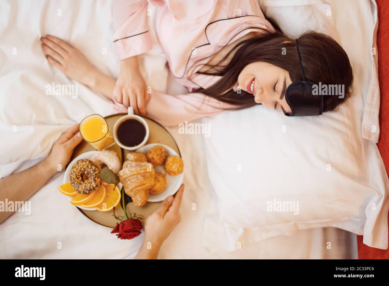 Romantic love couple, breakfast and rose in bed at home, good ...
