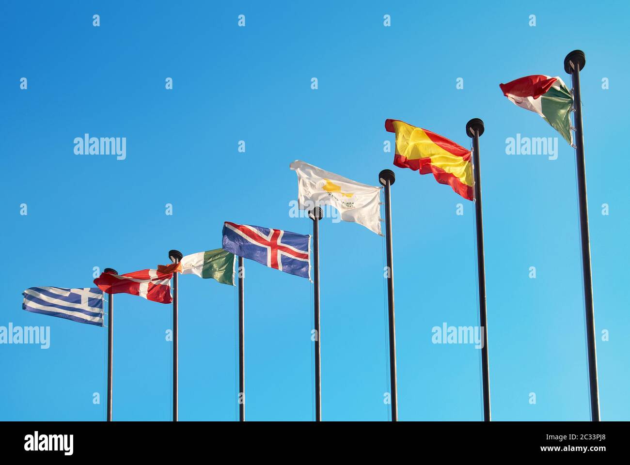 Row of european flags against blue sky background Stock Photo - Alamy