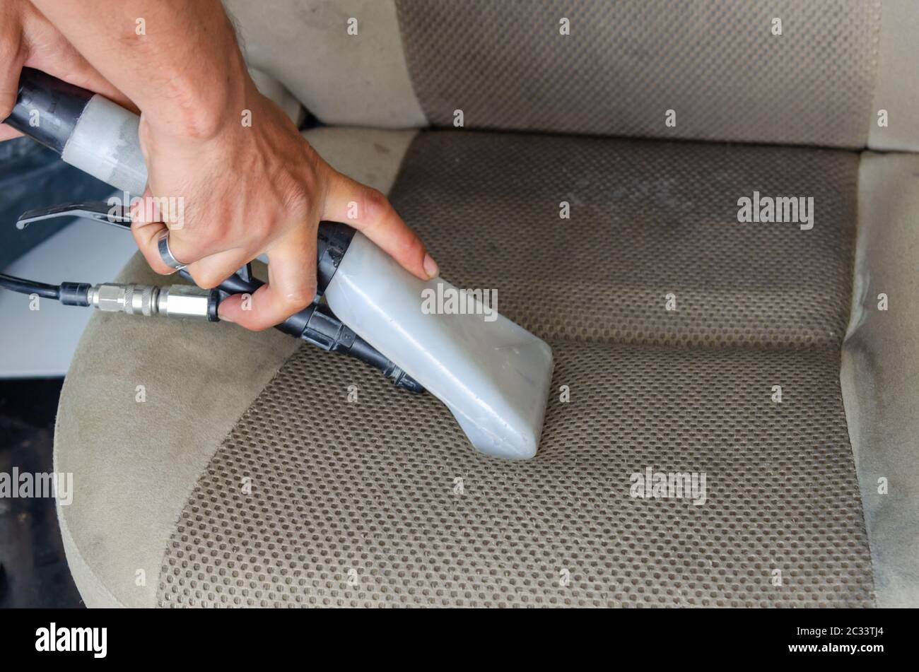 Clean car seats with a vacuum and disinfectant water Stock Photo Alamy