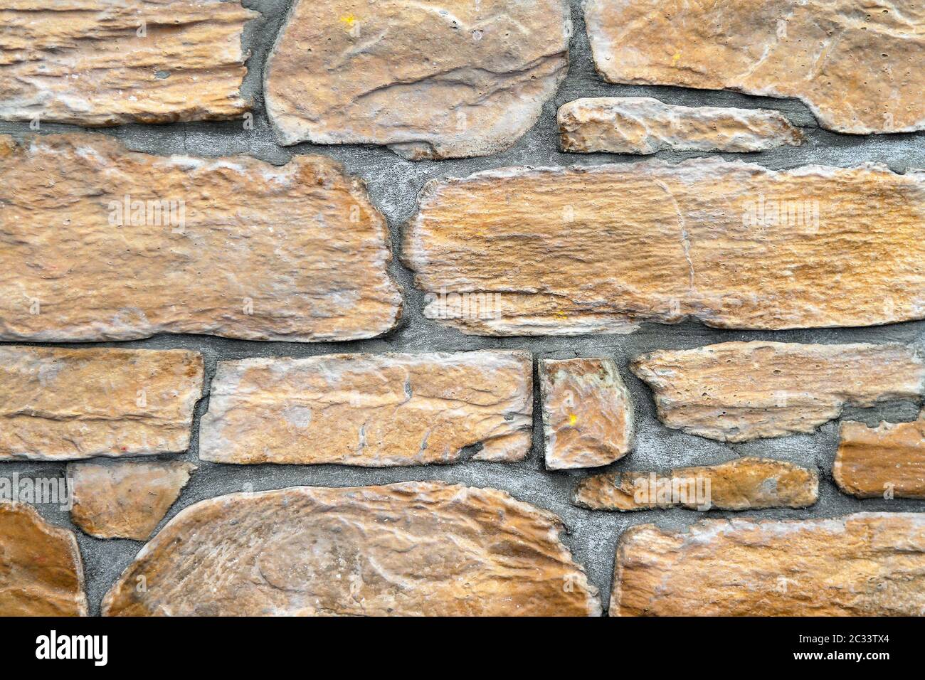 Yellow stone tiles at external wall Stock Photo Alamy