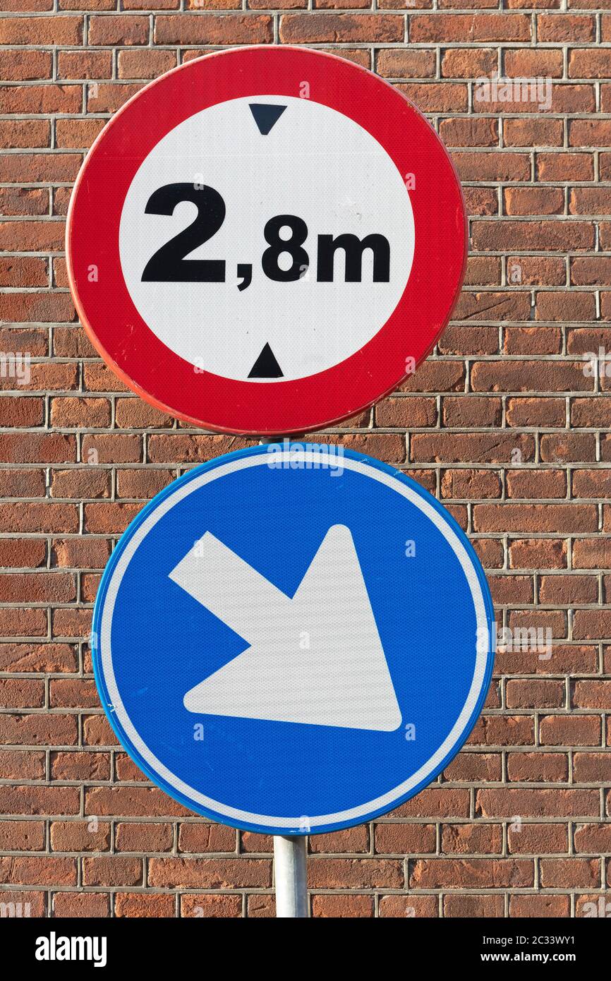 Traffic Signs Height Restriction and Direction Arrow at Pole Stock