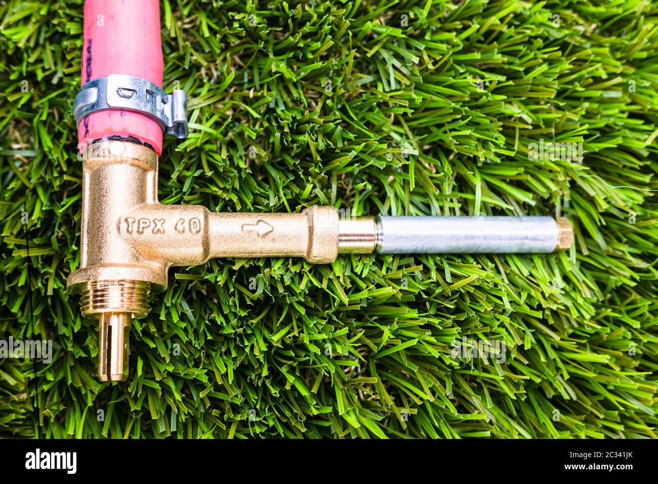 Gas bypass regulator connected to plastic pipes, on grass Stock Photo