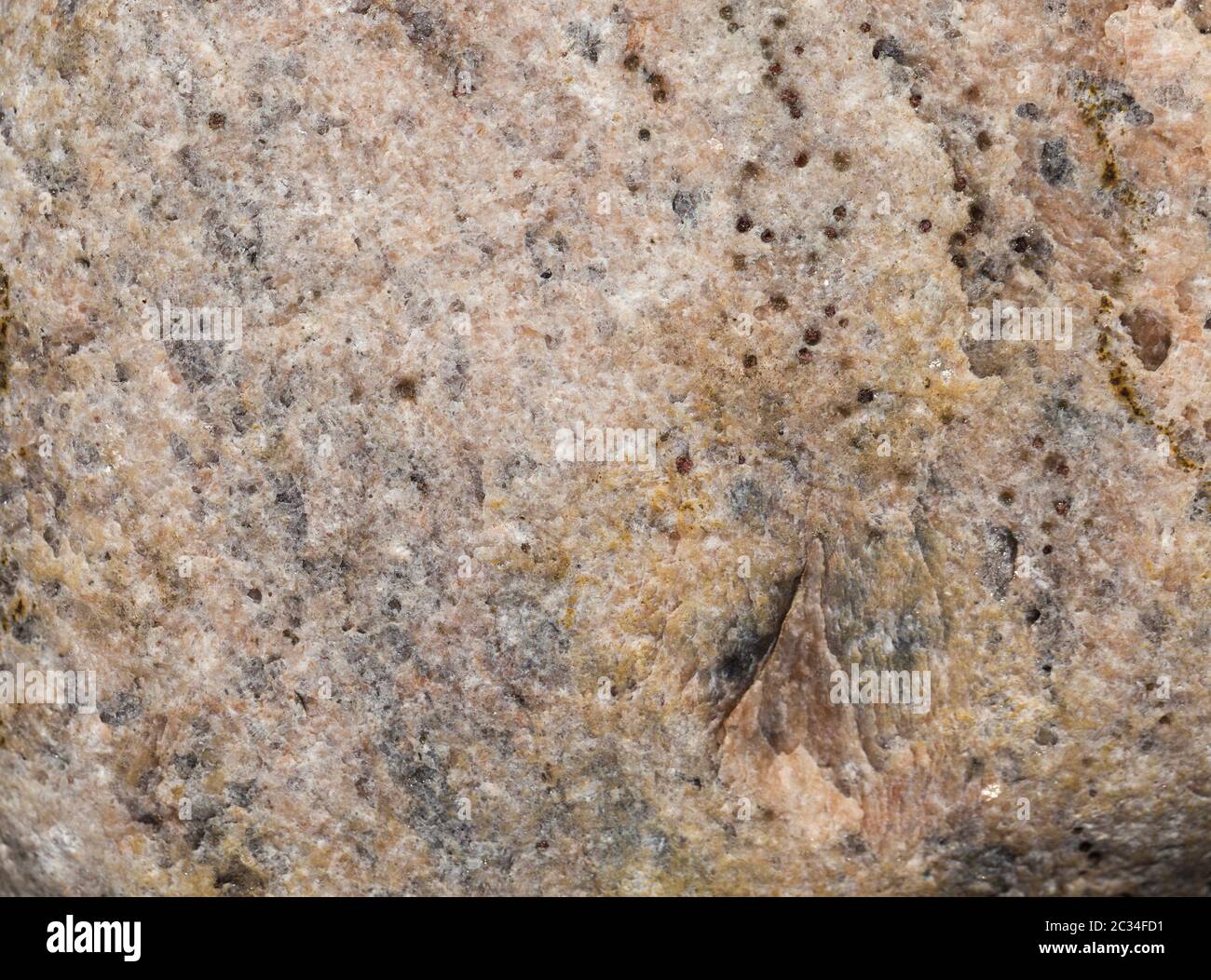 the structure of a large stone having several different colors, close ...