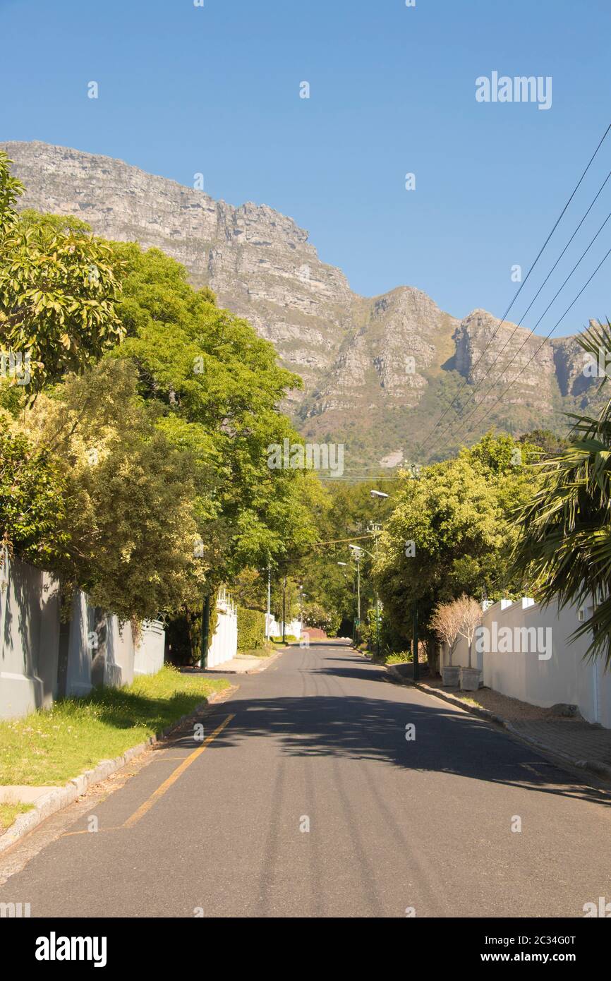 Street in the town of Claremont, Cape Town, South Africa. Sunny weather and panorama of Table Mountains. Stock Photo