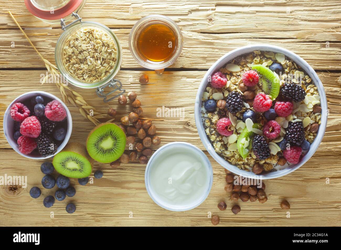 A Bowl Of Muesli With Fruit On A Wooden Background Stock Photo