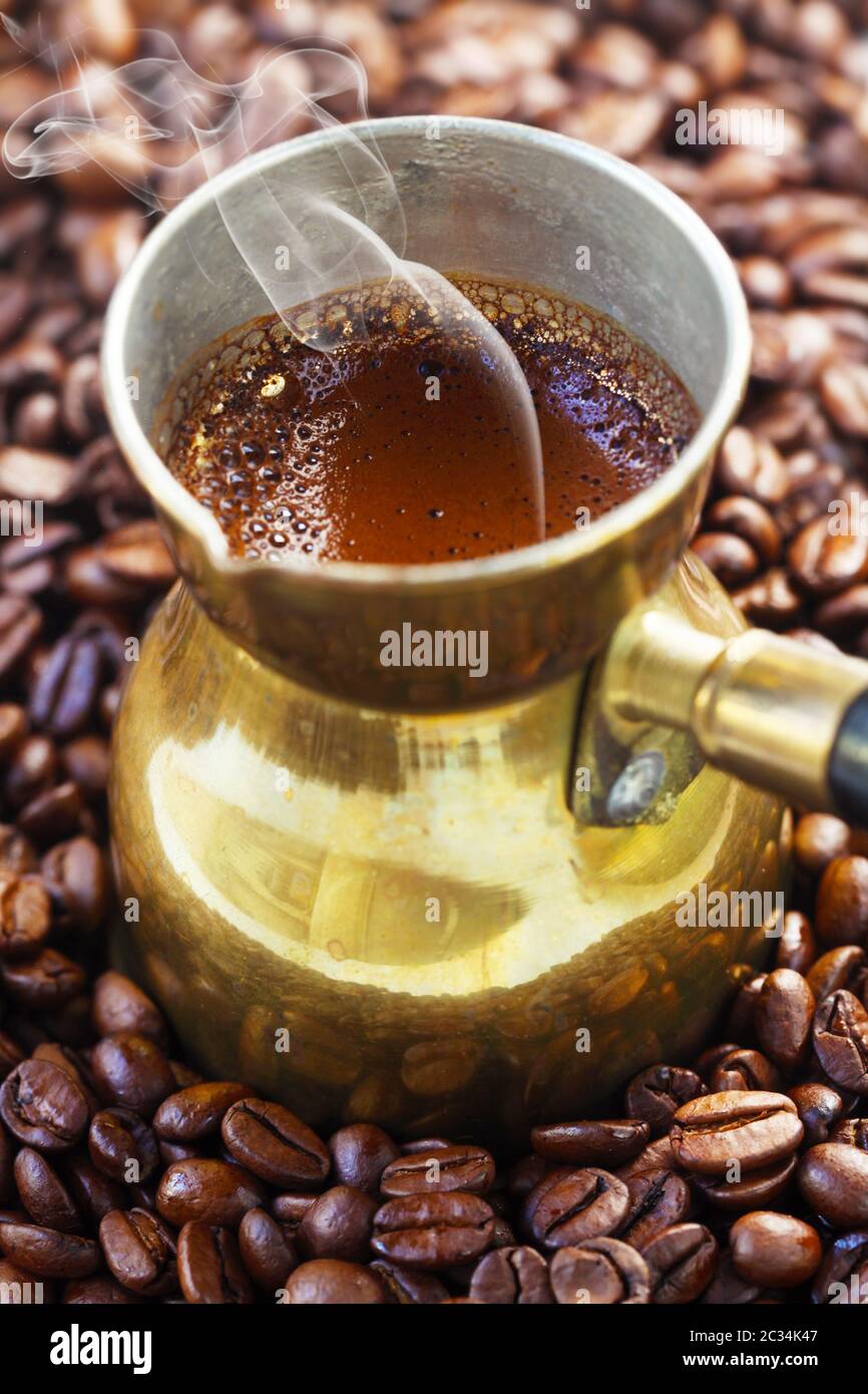 Steaming Espresso In A Turkish Coffee Pot Stock Photo