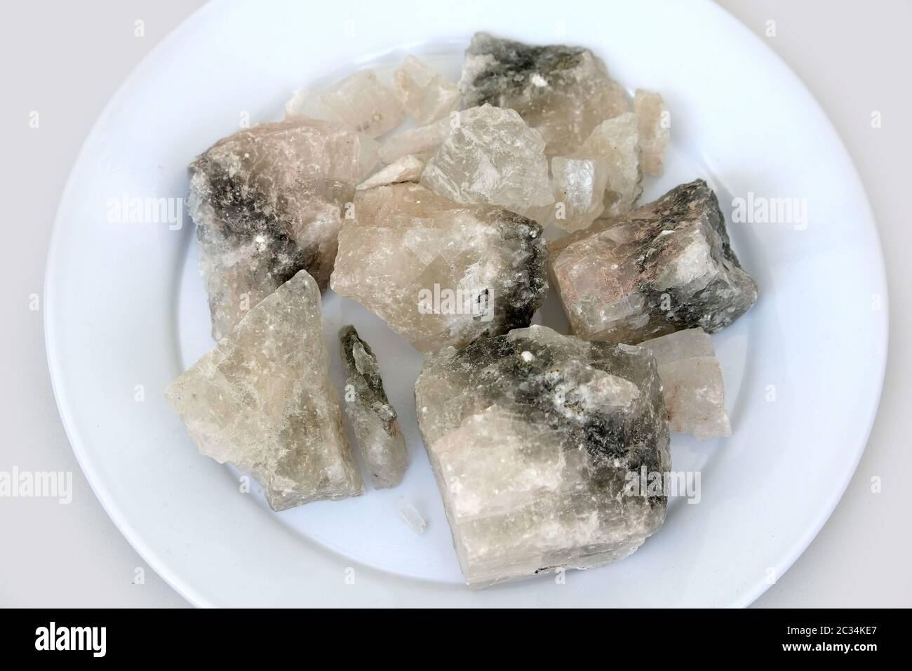 on a white background mineral source rock salt components Stock Photo