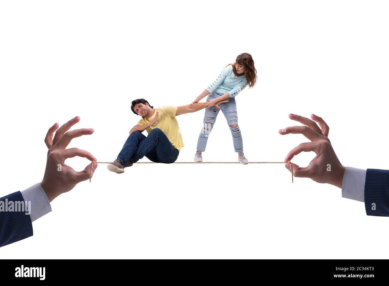 Young family on tight rope Stock Photo