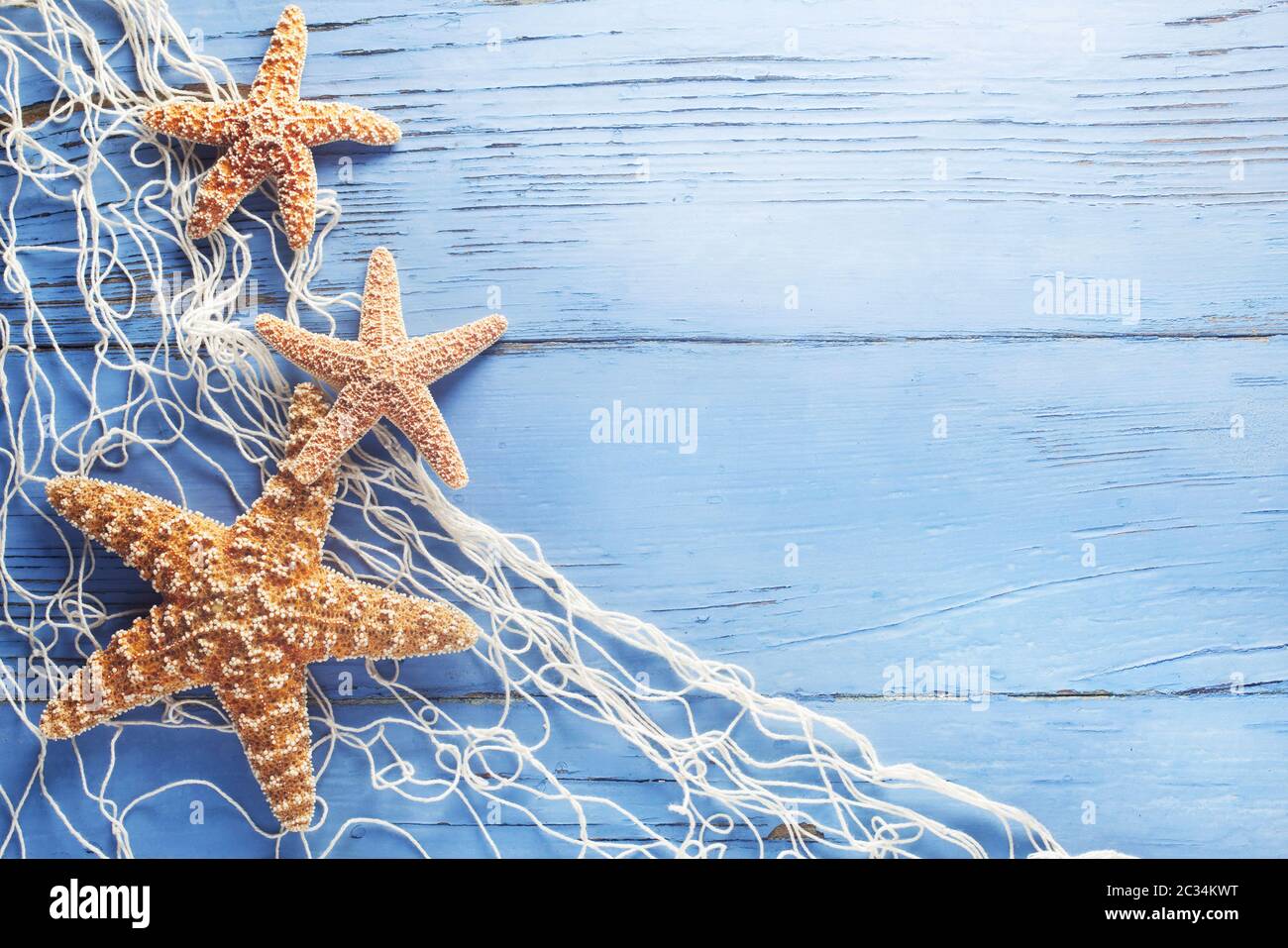 Maritime Background With Starfish And A Fishing Net Stock Photo