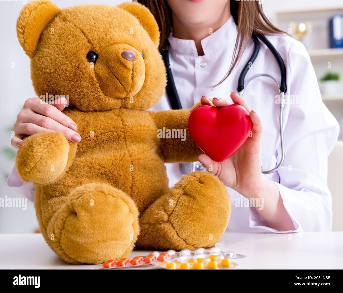 Child checking soft toy health Stock Photo