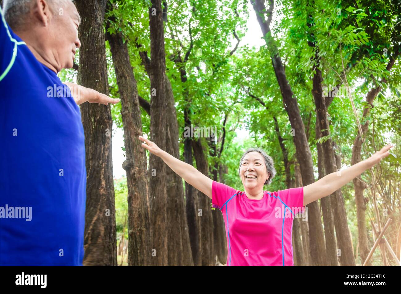 happy asian Senior couple exercising outdoors Stock Photo - Alamy