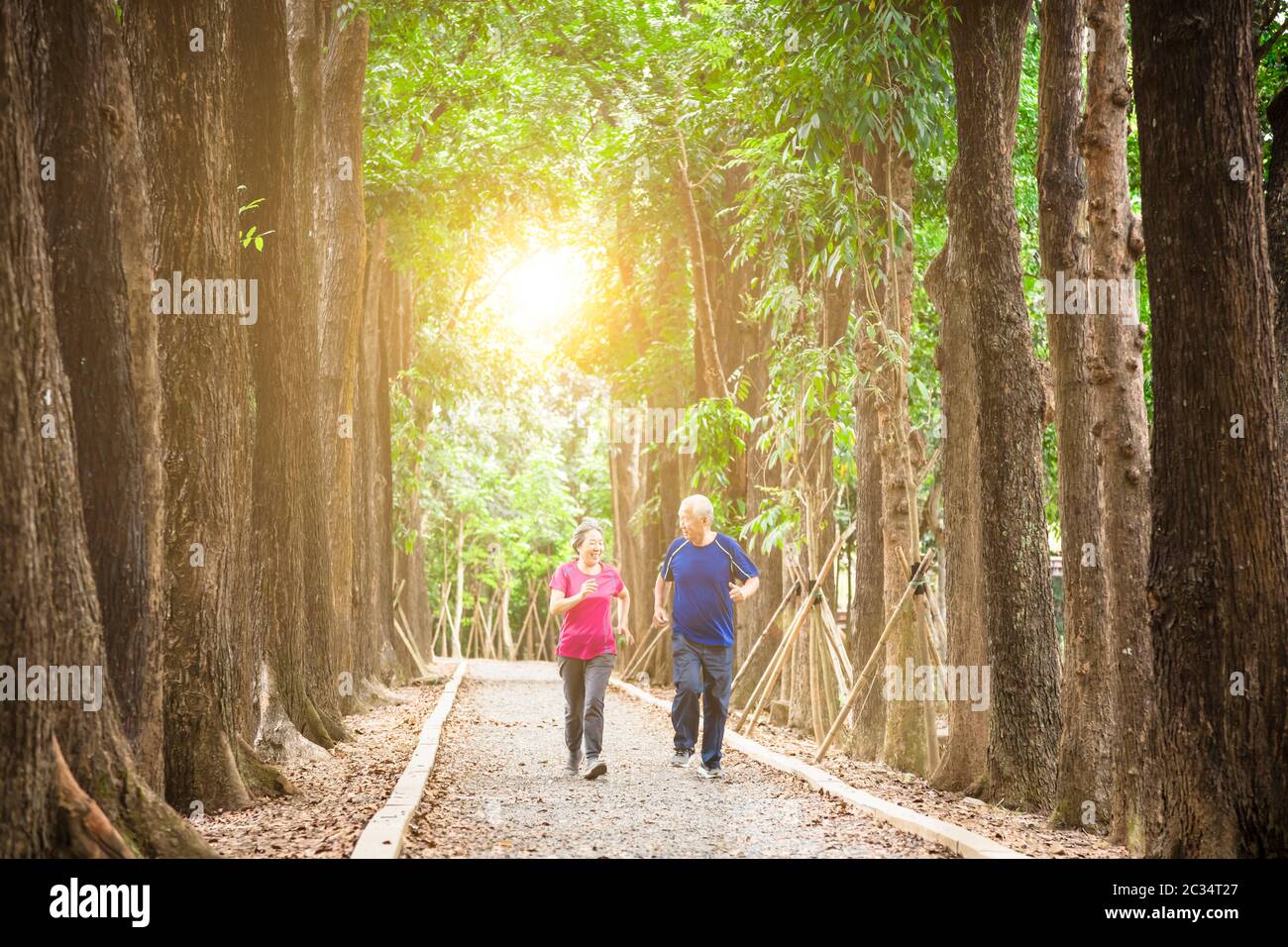 happy asian senior couple jogging together at morning Stock Photo - Alamy
