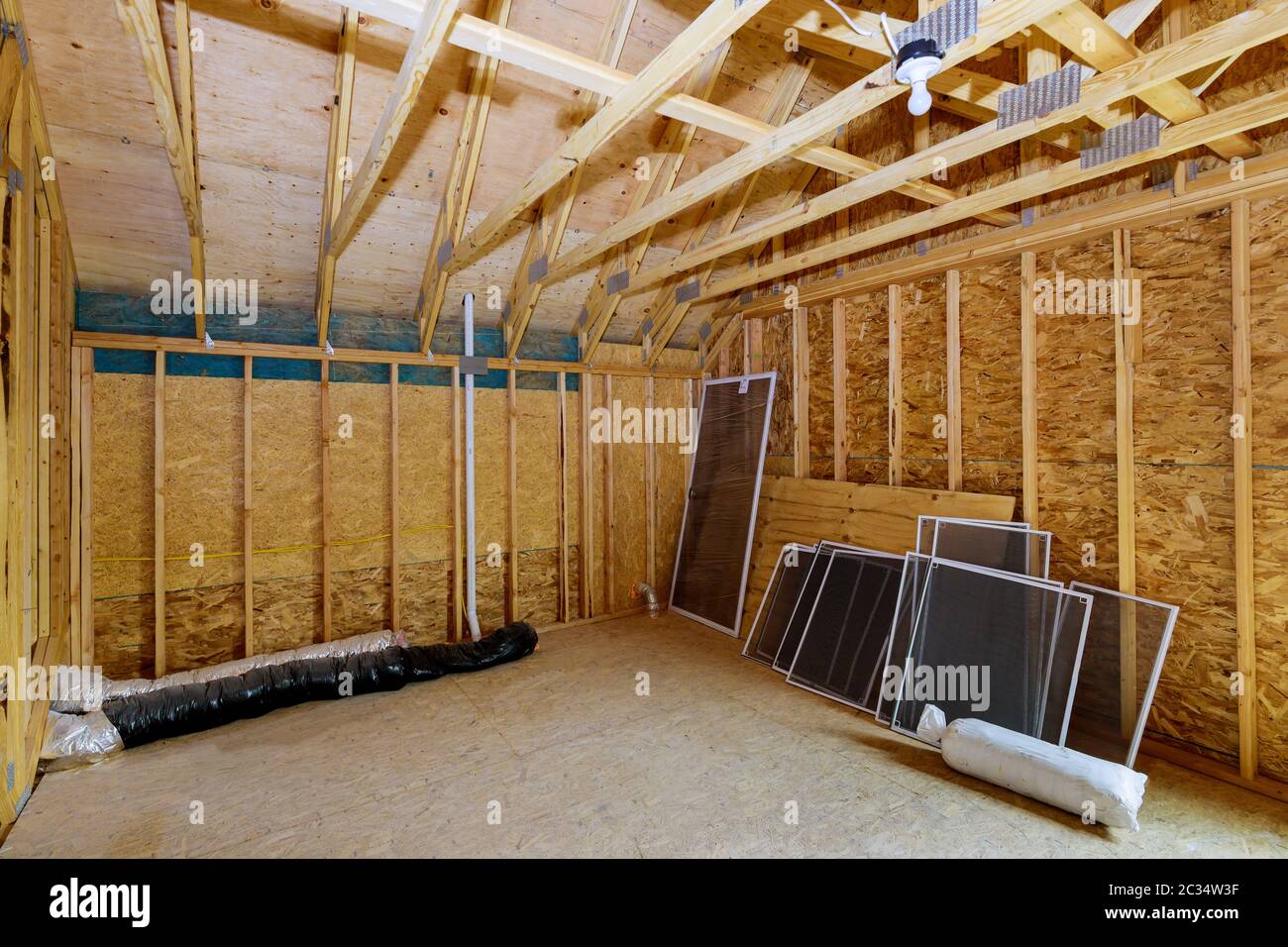 Beam framework frame house attic under construction interior inside a frame walls and ceiling in wooden material Stock Photo