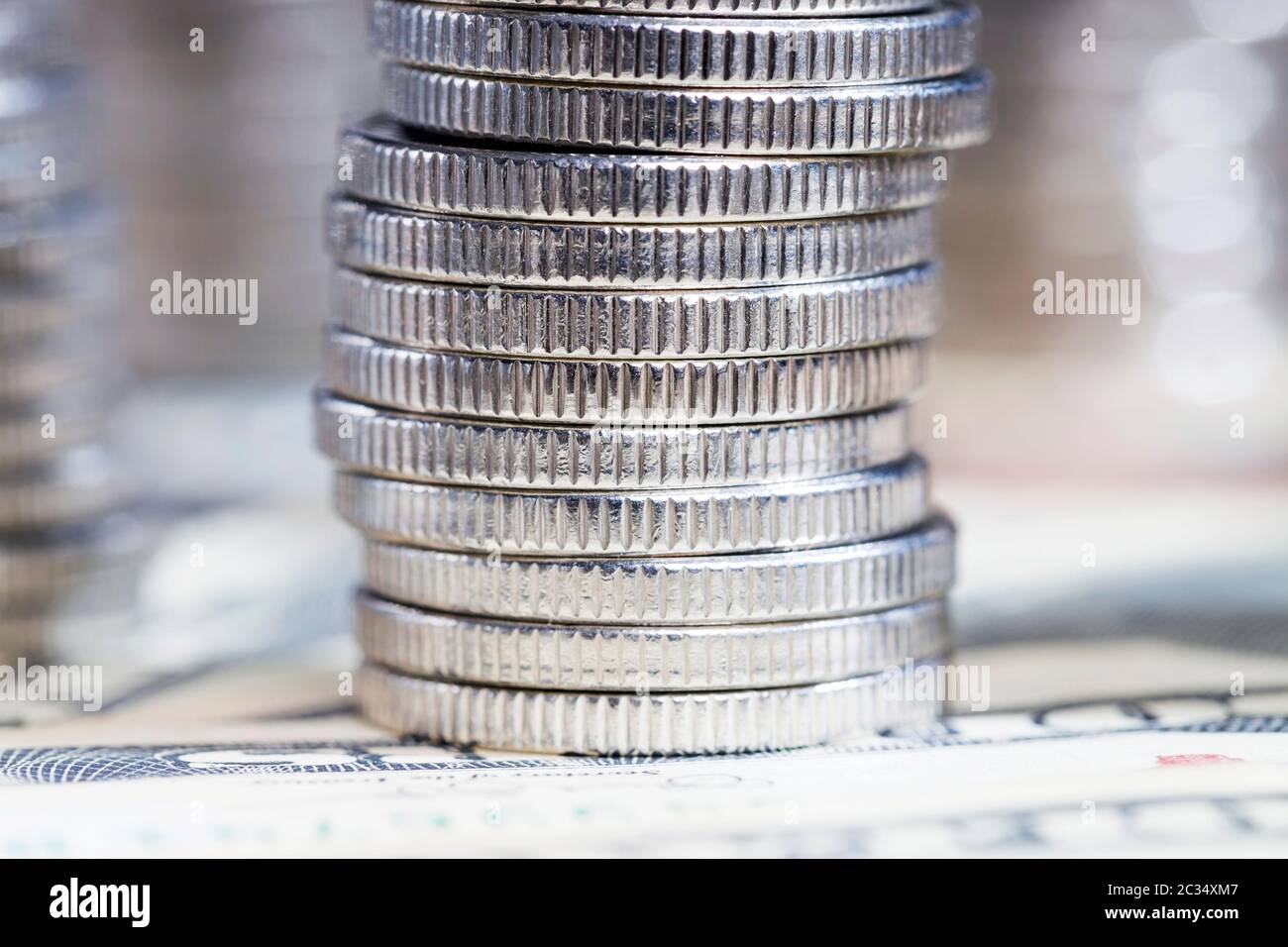 silver coins folded towers and lying on the paper currency of U.S ...