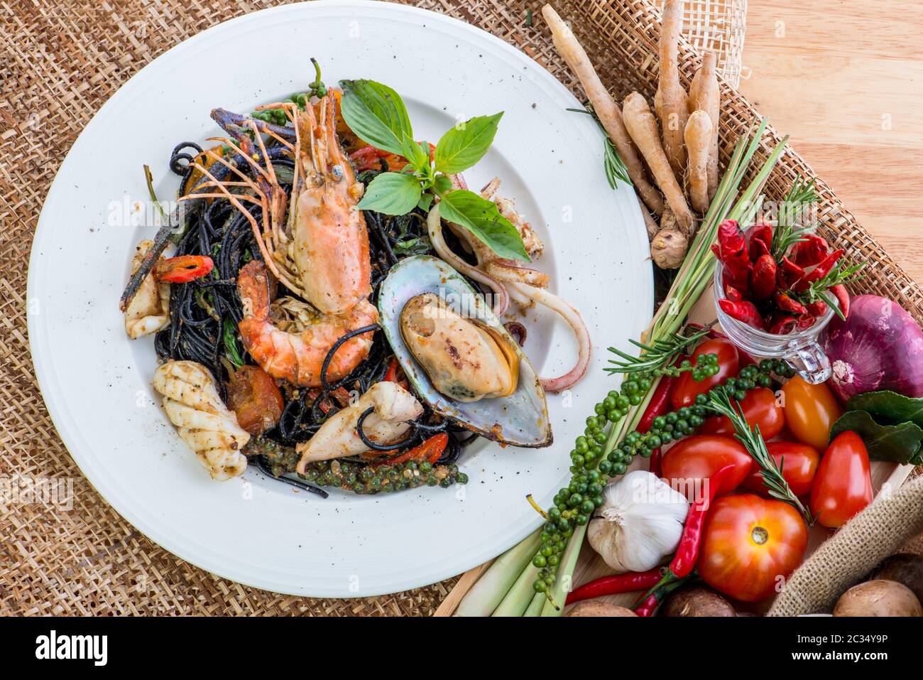 Black spaghetti Alle Vongole. Black seafood pasta with clams and yogurt