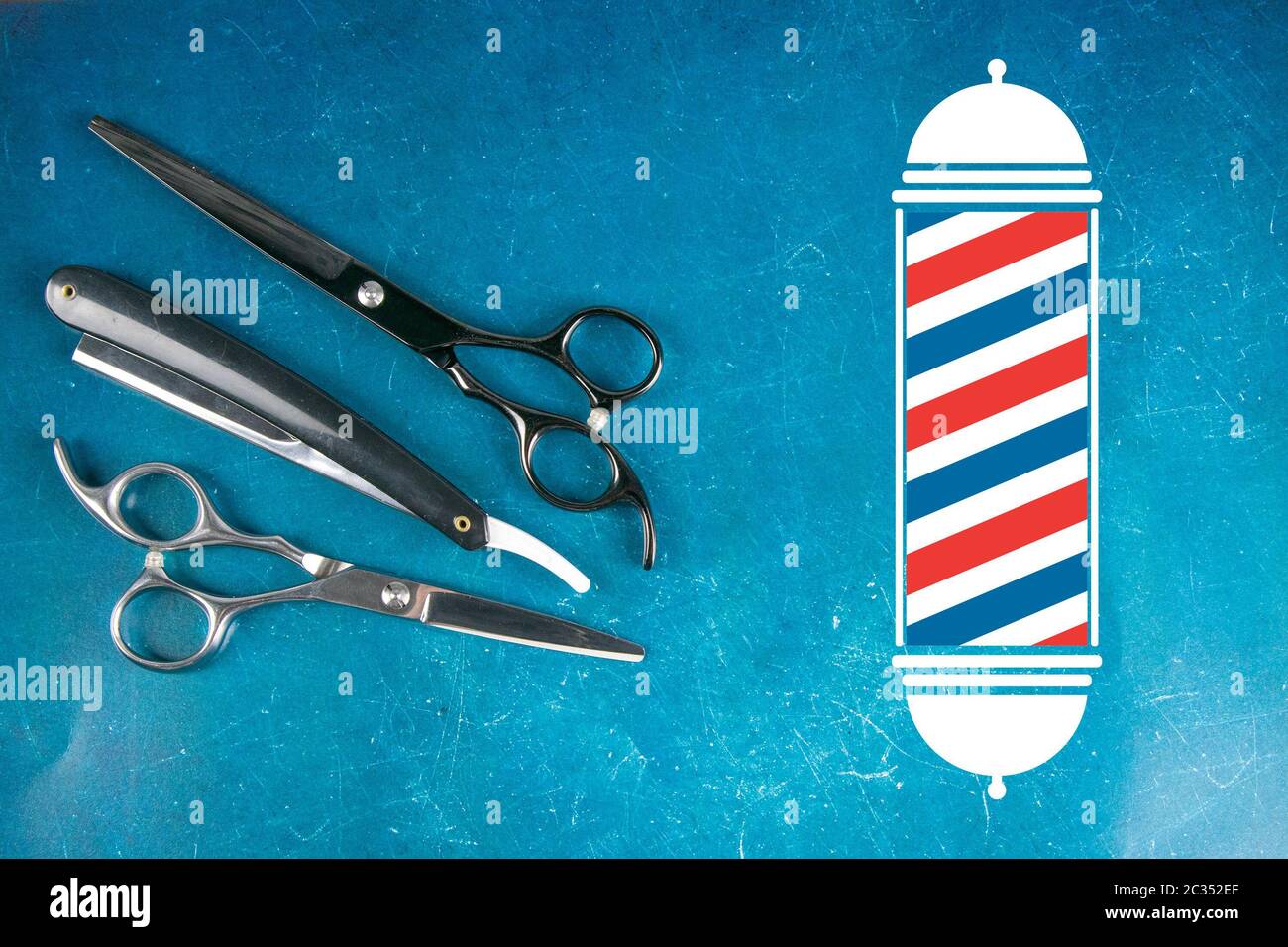 Scissors on blue background. Barber shop concept Stock Photo - Alamy