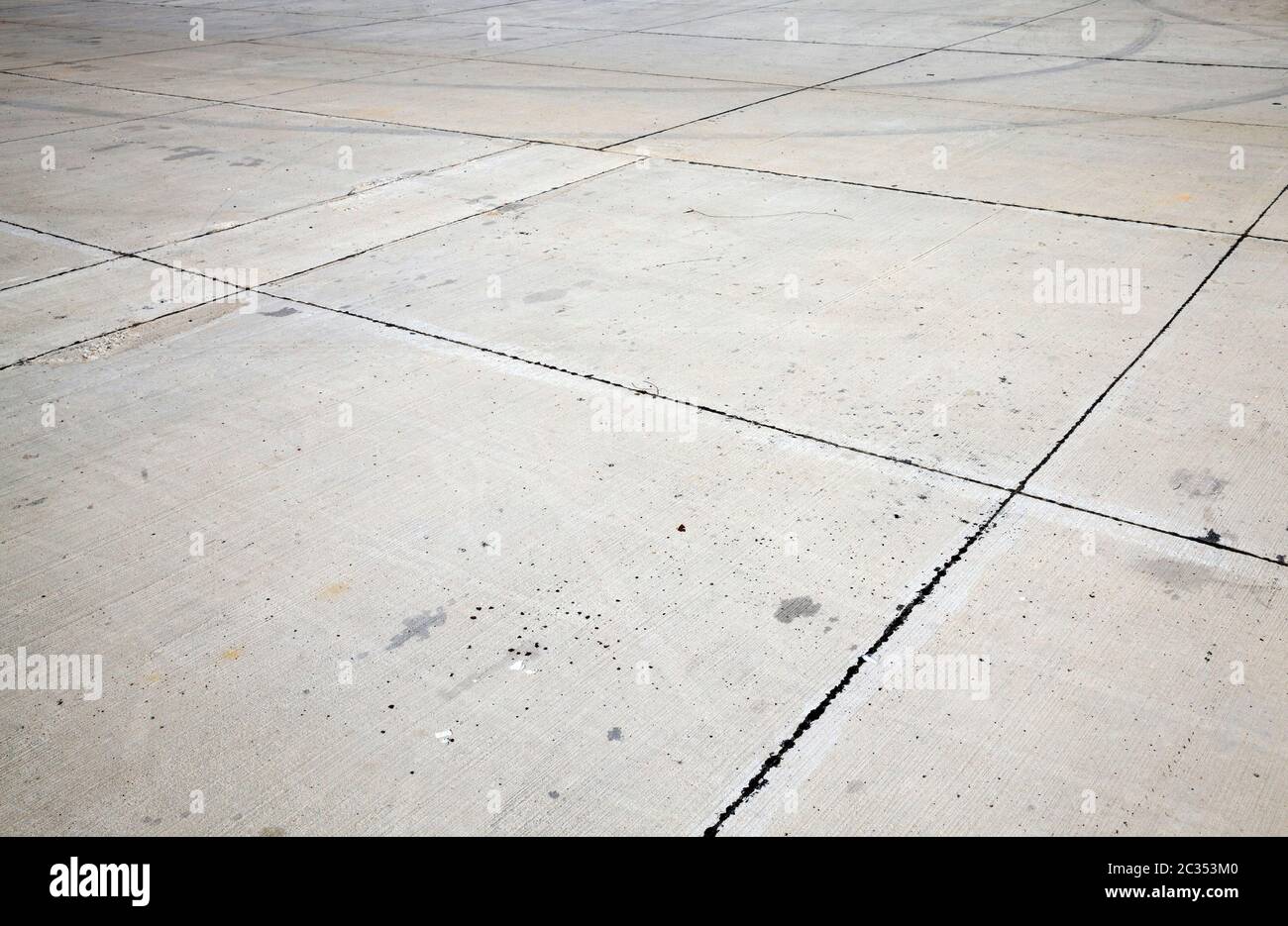 grey road made of concrete and slabs of concrete, made with excess