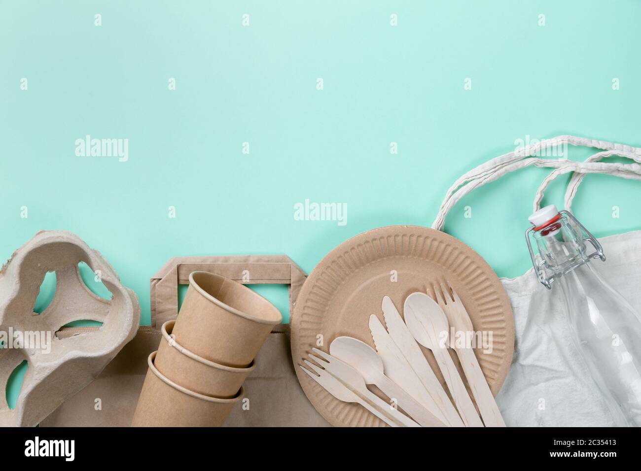 Sustainable eco friendly concept. Kitchenware on a teal background. Stock Photo