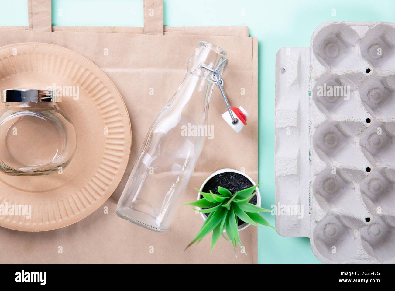 Sustainable eco friendly concept. Kitchenware on a teal background. Stock Photo