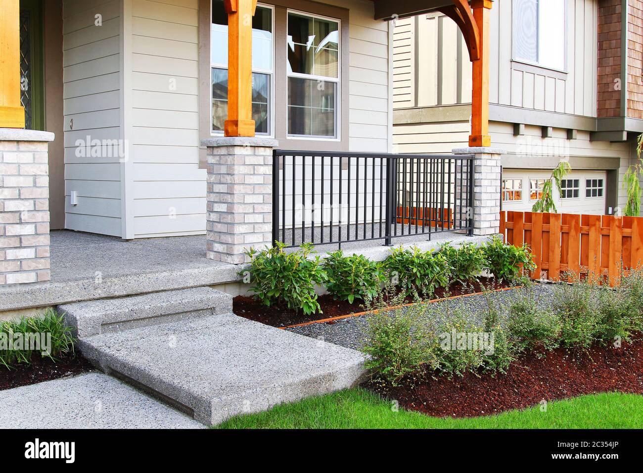 Family home with perfect grass landscaping with artificial grass Stock Photo