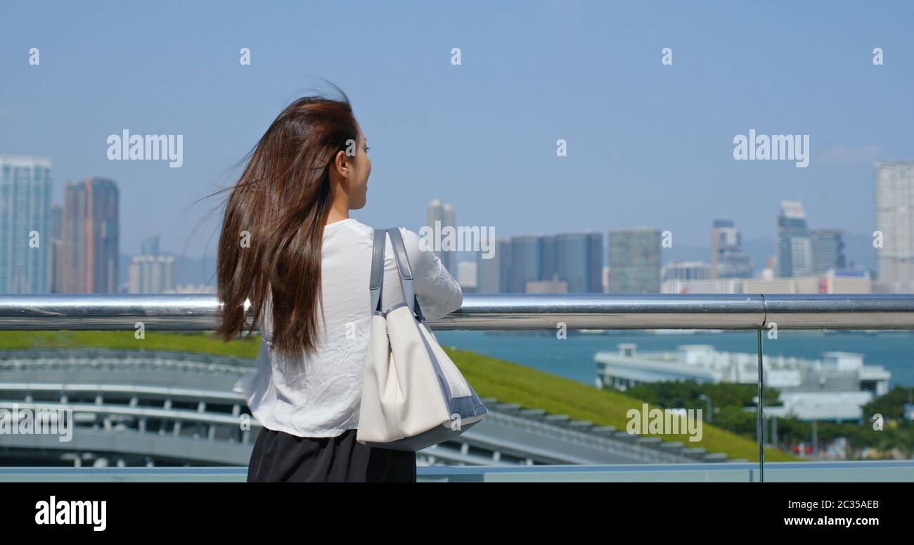 Woman look at the city view in Hong Kong Stock Photo - Alamy