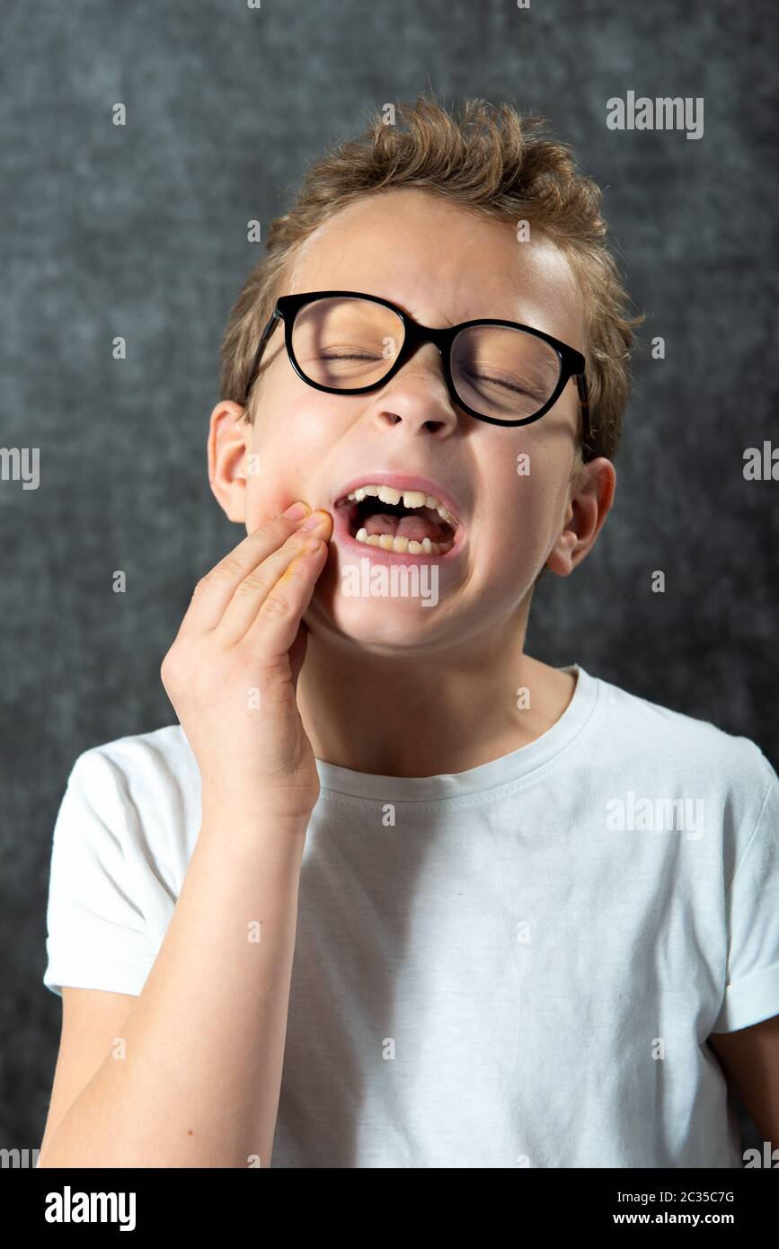 Portrait boy has a toothache. Face, expression Stock Photo