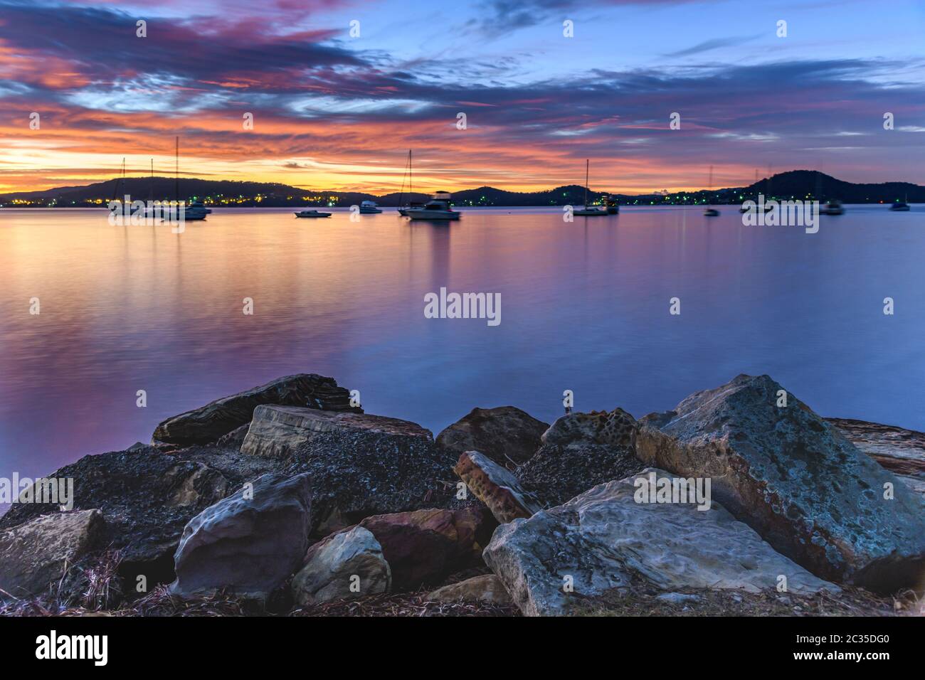 Colourful Clouds and Sunrise from Koolewong Waterfront on the Central Coast, NSW, Australia. Stock Photo