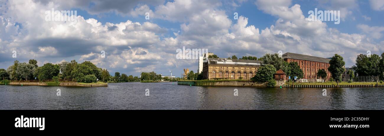 Old industrial facilities at the confluence of rivers Havel and Spree in the Spandau district of Str Stock Photo