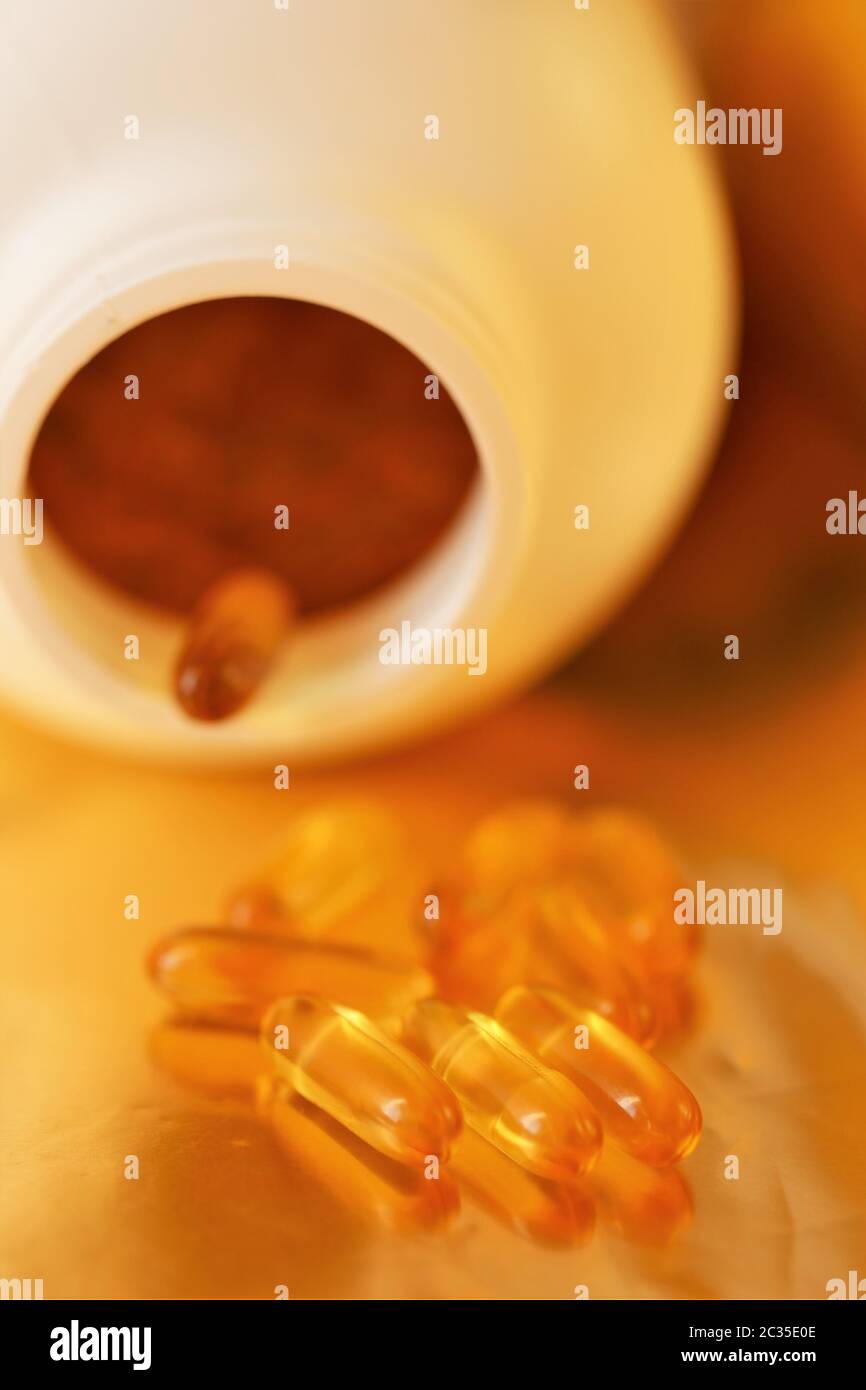 Fish Oil Gelatin Capsules on packaging blurred background.Omega three