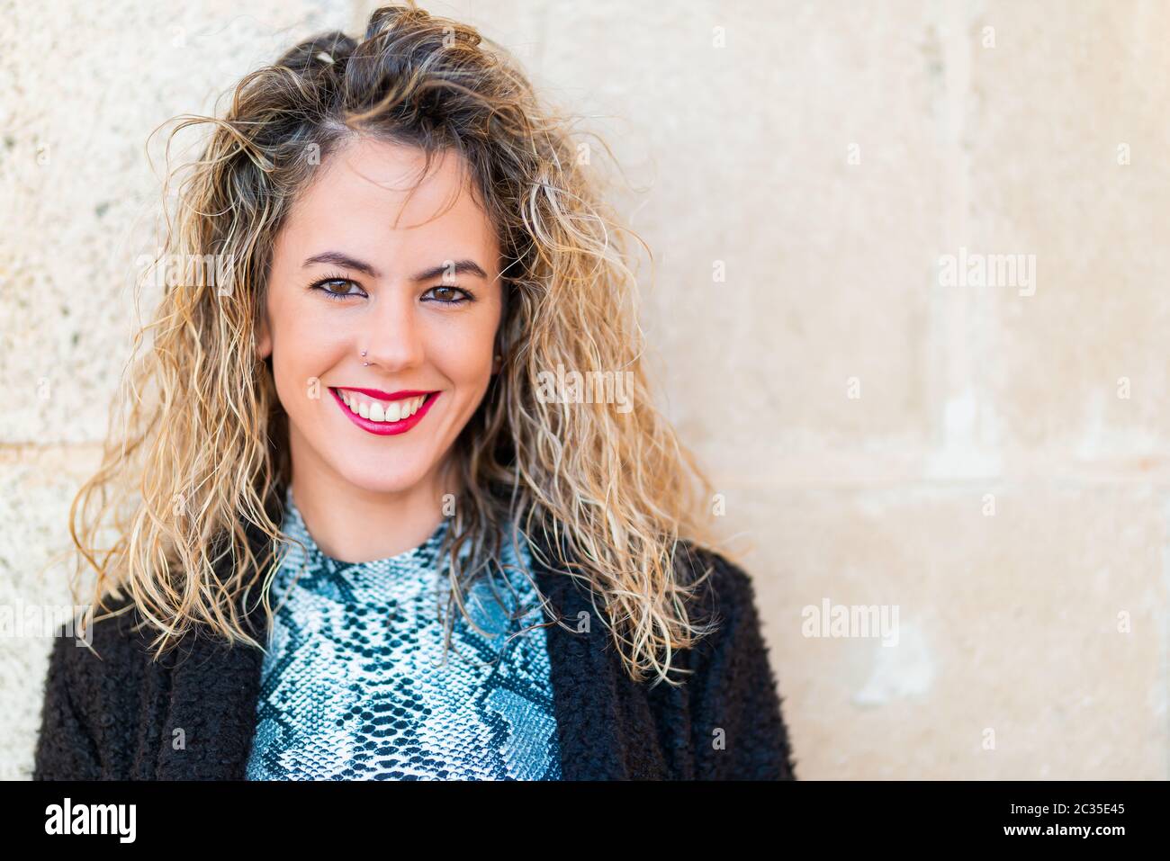 Close up portrait of a beautiful young woman with curly hair Stock ...
