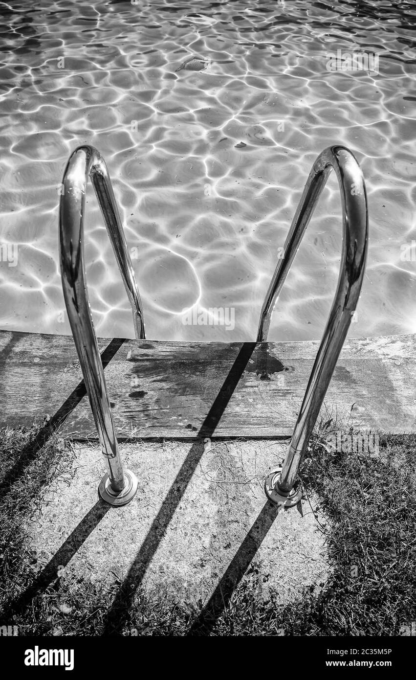 Pool with grass, detail of an outdoor pool in the ciuad, water and fun