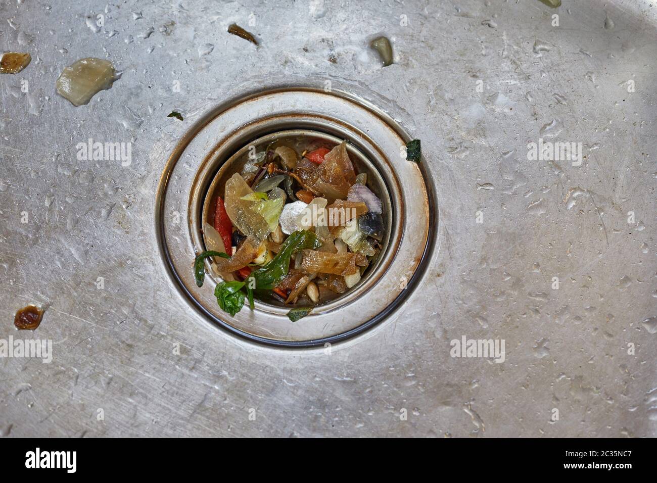 Kitchen drain clogging up with food particles Stock Photo Alamy