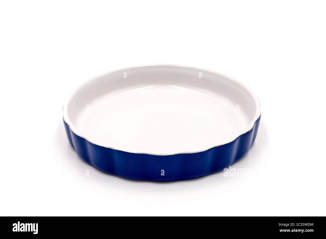 Blue porcelain ramekin on a white background Stock Photo