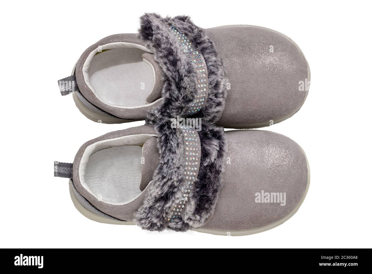 Child shoes fashion. Top view of a pair beautiful gray silver suede sneaker or sports shoes for girls with fur and rhinestone decoration isolated on a Stock Photo