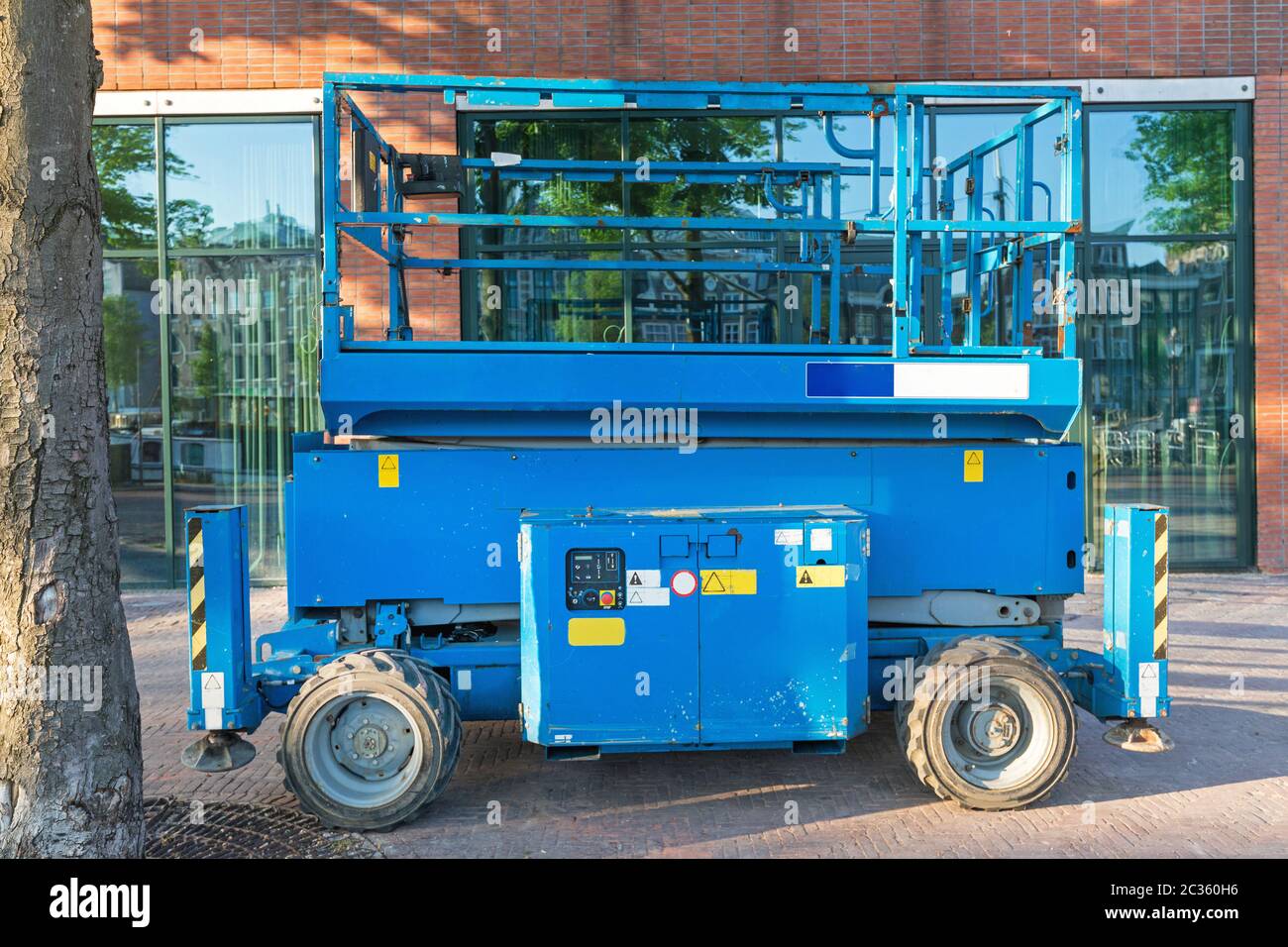 Blue Scissor Lift Aerial Work Platform at Street Stock Photo - Alamy