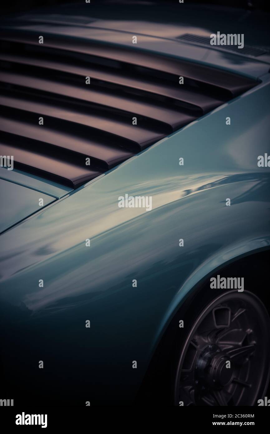 Classic Car Rounded Rear Window Close up shot of the rear window plastic shades of a classic vintage ...