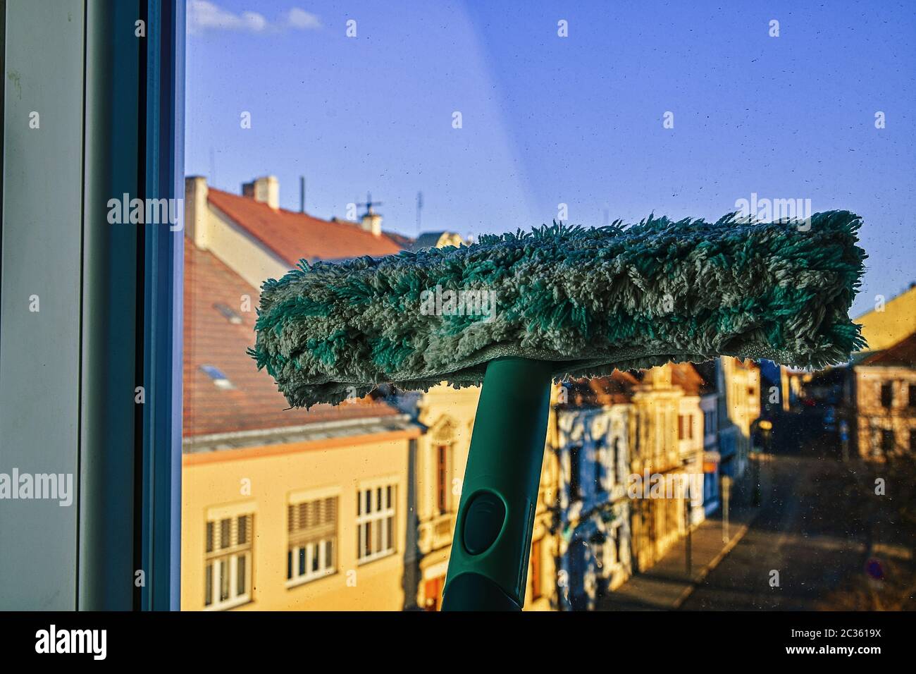 Cleaning windows with a squeegee. Cleaning concept. Washing window