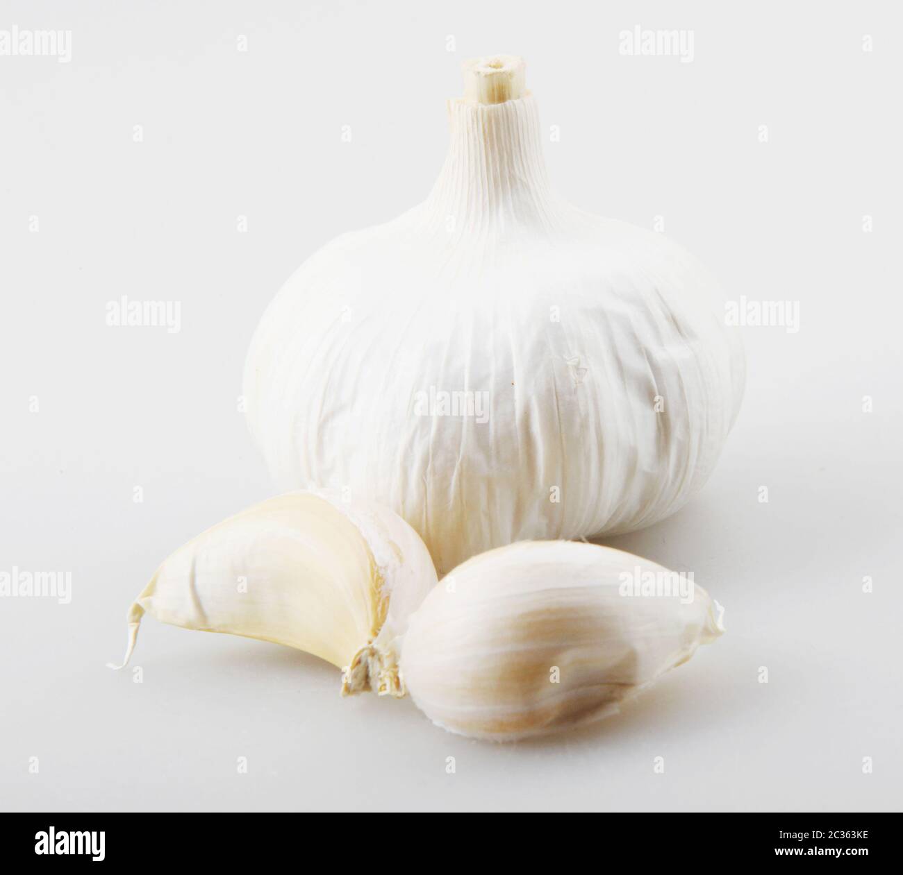 Close-Up Of Garlic Clove Against White Background Stock Photo - Alamy
