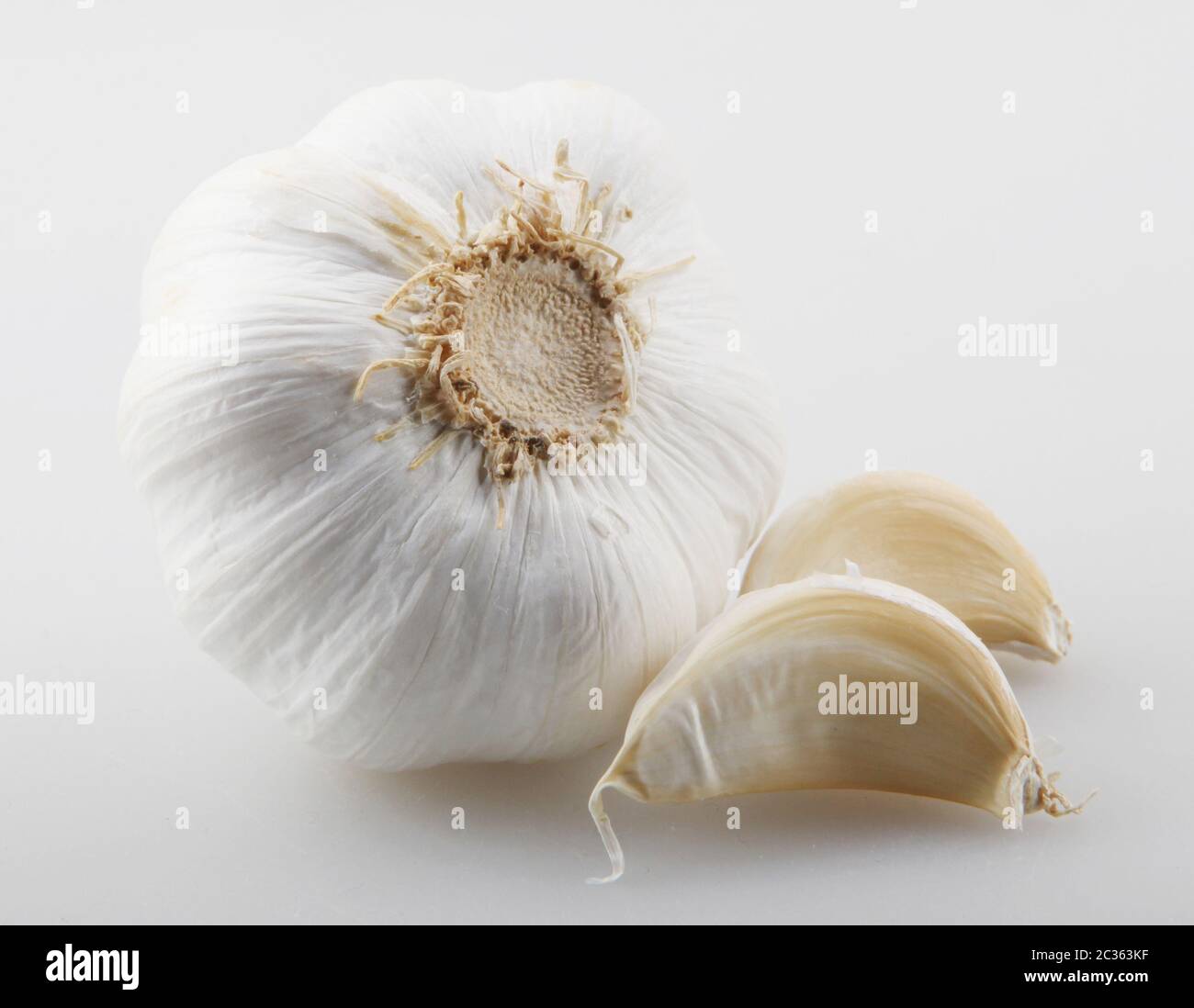 Close-Up Of Garlic Clove Against White Background Stock Photo - Alamy