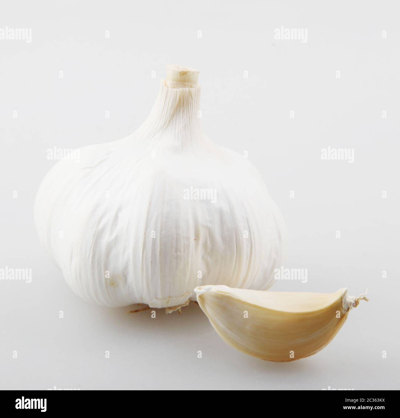 Close-Up Of Garlic Clove Against White Background Stock Photo - Alamy