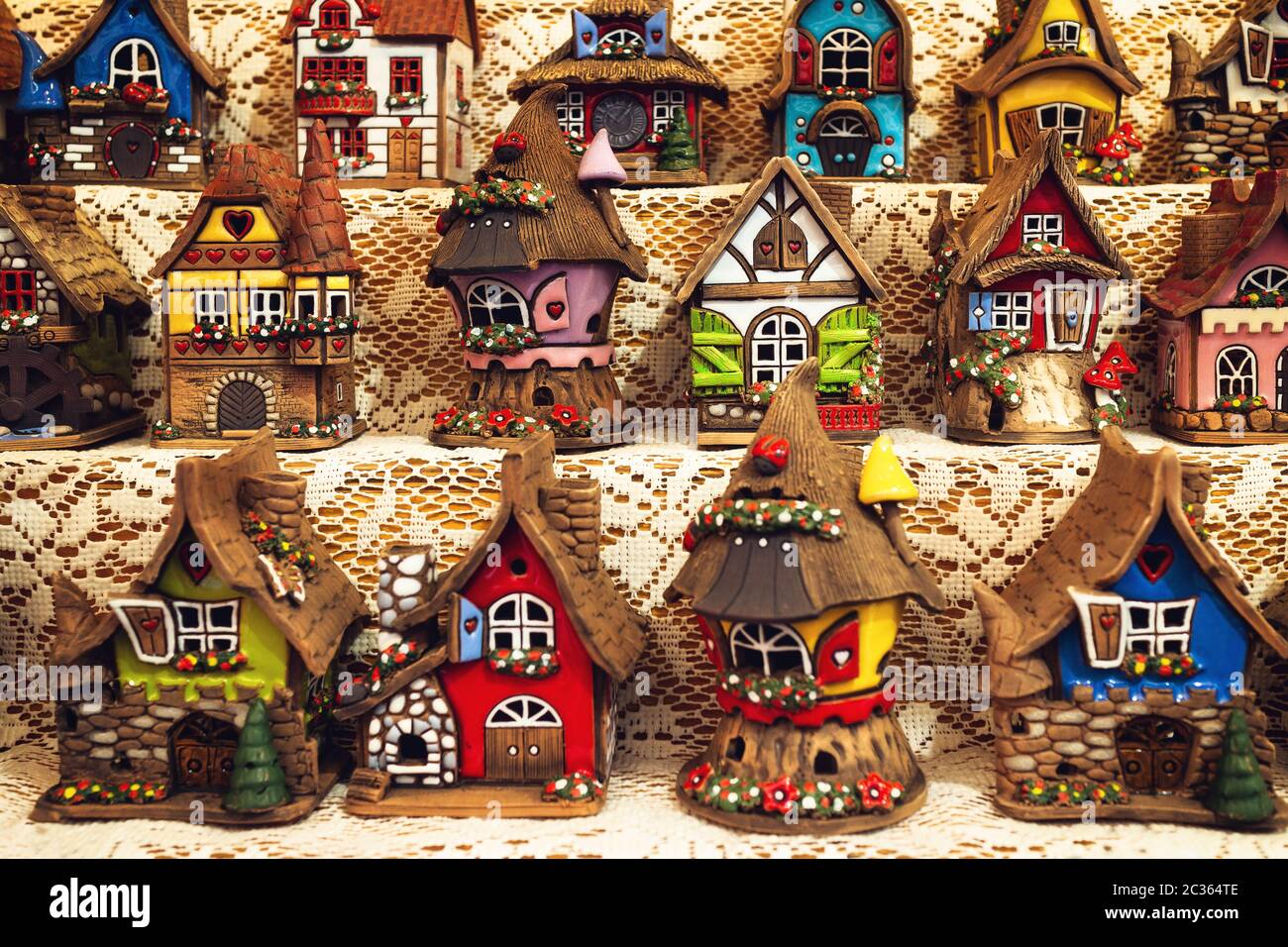 Many traditional north european ceramic small houses, usually used as essence burner for the home and christmas present Stock Photo