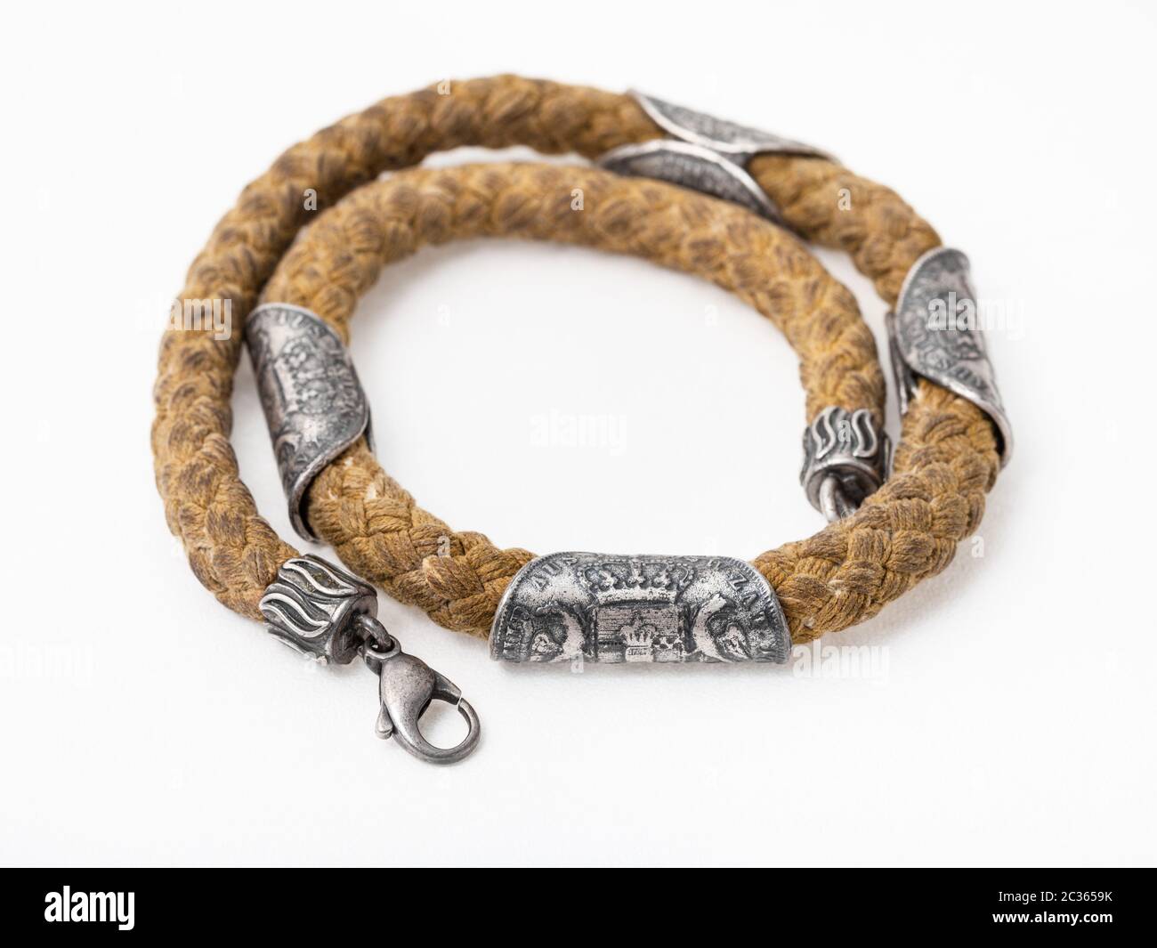 cotton rope with ancient silver coins 