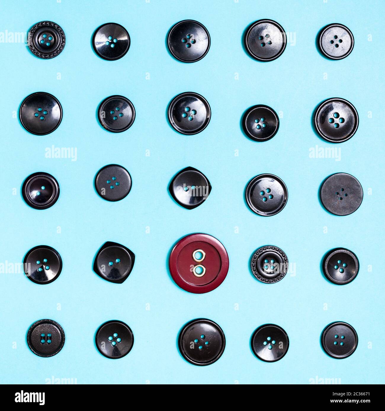 top view of different button between black buttons on blue background Stock Photo